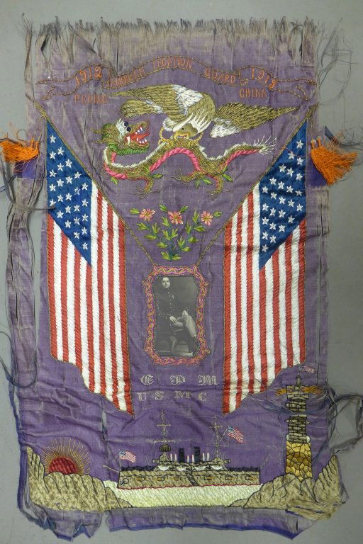 US in China Military Embroidery Panel w/ Photo: Antique and ornate embroidery with framed military photo, sewn American flags, dragon, bald eagle and ship. Top banner reads: American Legation Guard Peking China 1912- 1913. Bottom of photo reads: G.