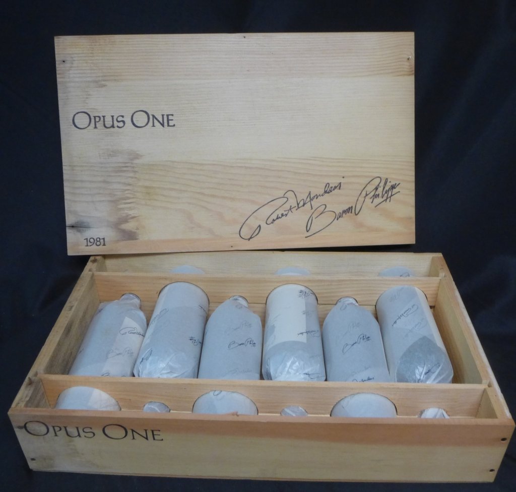 OPUS ONE Case 1981: A Napa Valley Red Table Wine. Produced and bottled by Robert Mondavi and Baron Philippe de Rothschild. Height: 12", Diameter: 2 3/4" & Height of Case: 4 1/2", Width: 21", Depth: 12 3/4" (Wine, Spirits
