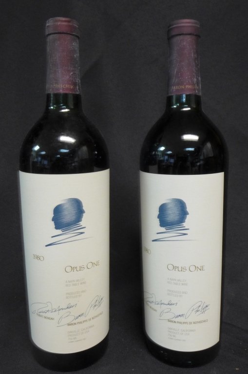 2 Bottles of OPUS ONE 1980: Two bottles of OPUS ONE 1980. A Napa Valley Red Table Wine. Produced and bottled by Robert Mondavi and Baron Philippe de Rothschild. Height: 12", Diameter: 2 3/4" (Wine, Spirits, Bottle, California, U