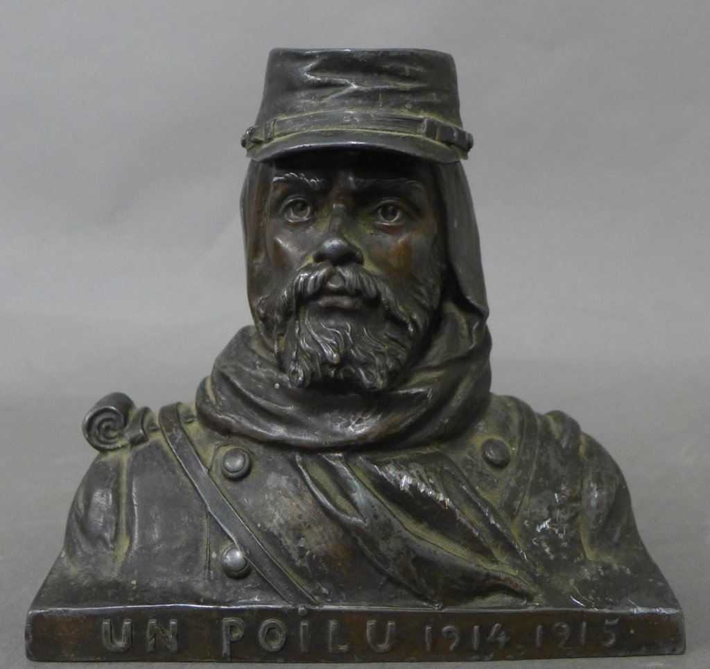 Metal Sculpture of French Legionnaire: Metal sculptured bust of French Legionnaire with very detailed design and an ability to open the hat part with hollow space on the inside. Signed on the front "UN Poilu 1914 1915" and engraved on the 