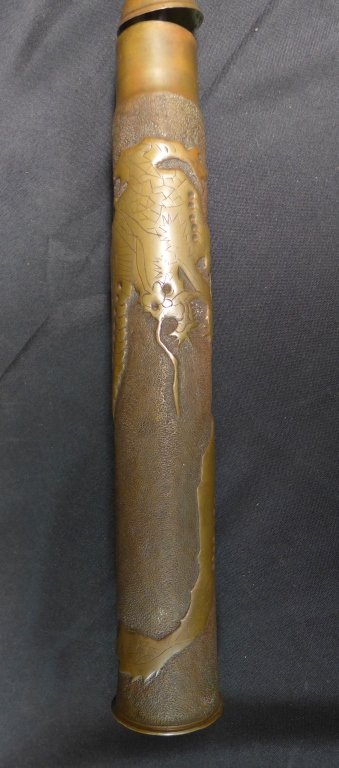 Trench Art Shell Case as Lamp: Artillery shell case that has been recycled and re-worked into trench-art decorative to lamp body. Ornate image od a Dragon. Bottom of shell reads: W.N.Y. 4 1906, 3Pdr. E.H.C.L. (anchor) S.P.F. Total