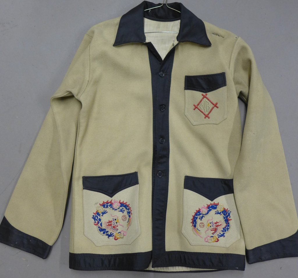 Vintage Chinese Embroidered Wool Jacket: Vintage Chinese embroidered wool jacket, circa 1930s. Possible a school or other institution uniform. Designed with nude color wool body and black silk accents on the sleeves, collar and pockets. Ther