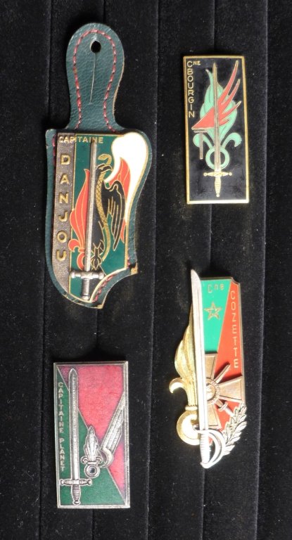 Collection of 4 FFL Captain Promotion Badges: Collection of four French Foreign Legion School Captain Promotion Badges. Includes: Captain Danjou (Regiment Etranger), Captain BOURGIN (2nd REP), Captain COZETTE (REI 53) & Capitaine PLANET (2e REP).