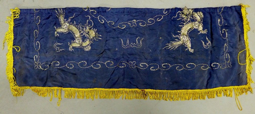 Antique Chinese Flag, French Foreign Legion: Two dragons embroidered with metallic threads on a navy background. Yellow fringe around 3 sides. Some noticeable discoloration and wear. Sewn patch/ label on back, writing in French, dated: June 9, 1