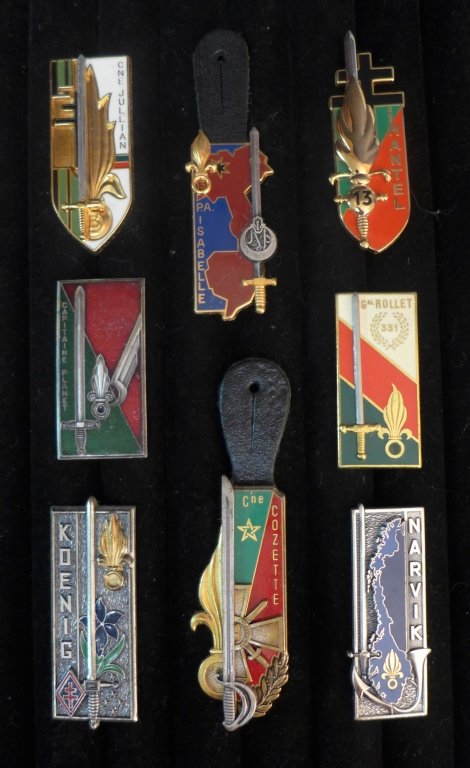 Assortment of 8 FFL School Promotion Badges: Assortment of 8 French Foreign Legion School Promotion Badges. Includes: Narvik, Capitaine Planet, Koenig, 13 PA Isabelle and more.Maker marks. Possible re-strikes. From the collection of Gene Christi
