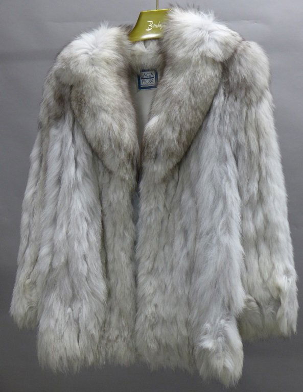 Arctic Fox Fur Coat: Vintage Arctic Fox coat. Maker's label reads: Saga Fox, Guarantee of Quality. One hook and loop closure in front. Inner lining of jacket is embroidered: Diane P. Some areas of separation of lining to