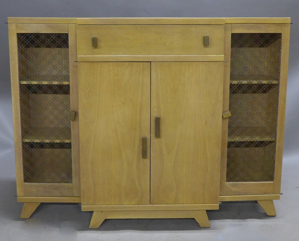 Mid Century Bar Cabinet: Bar cabinet with woven metal mesh side panels/ doors. Rectangular patinated brass knobs. Lower front cabinet doors open to reveal additional storage/ shelving. Some noticeable wear. No visible maker's