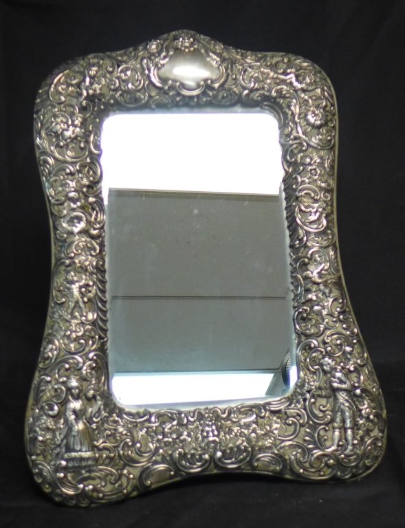 Antique Silver Dressing Table Mirror: Antique Victorian sterling silver large hand-chased vanity mirror with floral and figural decoration. Highly detailed. No noticeable markings, tested positive for silver with nitric acid test. Some sl