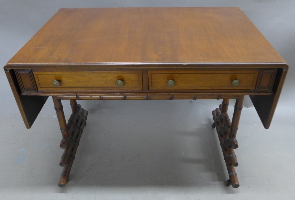 Drop Leaf Writing Desk: Vintage expandable wood desk with two front drawers and faux bamboo legs. Ornate drawer pulls/ knobs. No noticeable maker's marks or labels (in the style of Ficks Reed Classics). Sight age appropriate