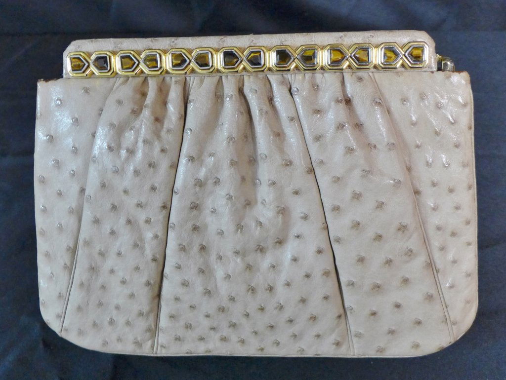 Vintage Judith Leiber Tan Ostrich Leather Clutch: Vintage Judith Leiber Tan Ostrich Leather Clutch with tiger eye and gold accents across top.Bag opens by pulling a side tab.Includes all original accessories shown (mirror, tasseled comb and pouch, al