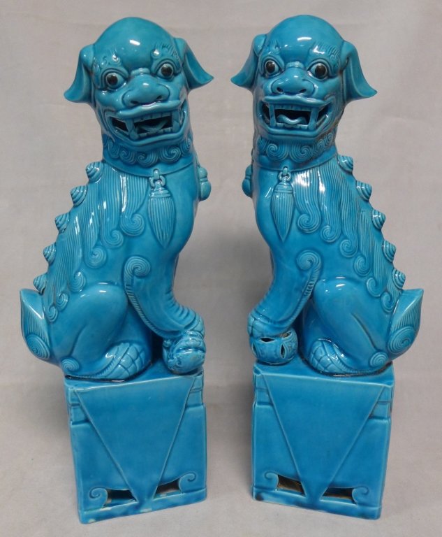 Chinese Turquoise Blue Porcelain Foo Lions/ Dogs: Pair of vintage Asian Fu lion dog statues. Vibrant turquoise glaze. No noticeable maker's marks. Some imperfections in glaze at bottom. Height: 12", Width: 4", Depth: 2 3/4" (Figurine, collectible, an