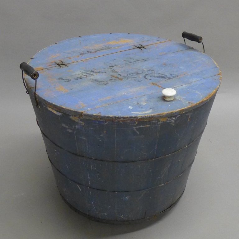 Antique Painted Wood Storage Barrel w/ Hinged Lid: Old wood round barrel painted a light shade of blue. Handles on either side and knob on lid. Paper label on underside of lid reads: Scull's Fancy Blend. Three caster wheels on bottom. Height: 17 1/4",