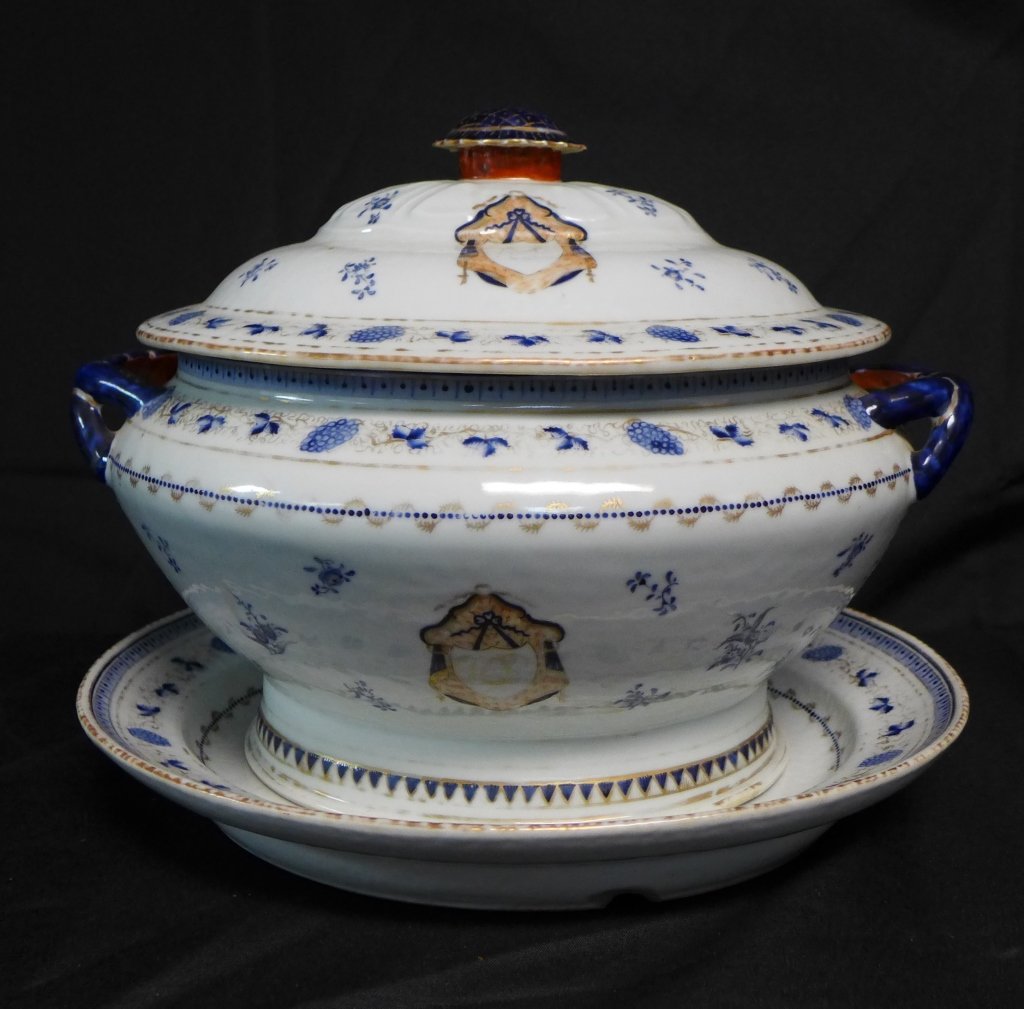 Soup Tureen and Platter: Lovely soup tureen with accompanying serving platter and lid. Lovely painted floral and gilt designs. Hand painted crest on all three pieces. The cover has a large cobalt blue and gilt painted finial.