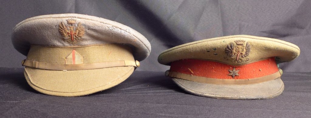 2 Embroidered Military Officer's Hats: 2 Embroidered Military Officer's Hats. Vintage military officer's hats with embroidered cap badges and side buttons. Height: 5 1/2", Width: 10 1/2"; Depth: 10 1/2". (Calvary, uniform, dress cap,6 poin