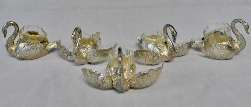 Silver and Crystal Swan Salt Cellar Dishes: Collection of five antique figural open salt cellars. Hinged wings open and close. Fitted clear crystal liner. Possible German. Stamped with hallmark and "800" on bottom of each. Height: 2 1/4", Lengt