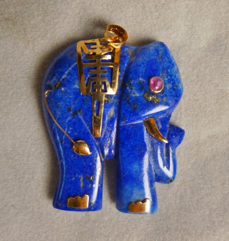 Gold & Lapis Elephant Pendant: Gold & Lapis Elephant Pendant. 14k Gold Lapis Lazuli Elephant Pendant With A Ruby Eye. Marked on clasp. Height: 1 1/8"; Width: 7/8". Weight: 5 grams. (good luck, pachyderm, Japanese, Chinese, Asian) C