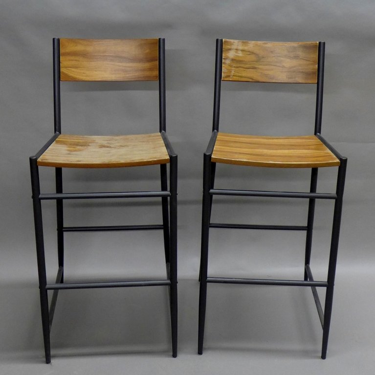 Pair Rustic Modern Bar Stool Chairs: Nice pair of industrial style bar/ counter stools. Steel frames with wood seats and backs. The wood needs refinishing on both chairs. One screw on lower back leg does not match the rest of the hardwar