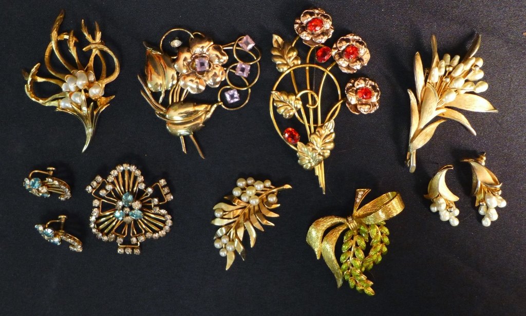 Collection of Vintage Pins and Earrings: Collection of Vintage Pins and Earrings. Brooches and earrings in various styles, sizes and shapes. Includes 11 pieces. Markings include Kramer, Boucher, Trifari, Joan Rivers, M&S and more. (gold tone