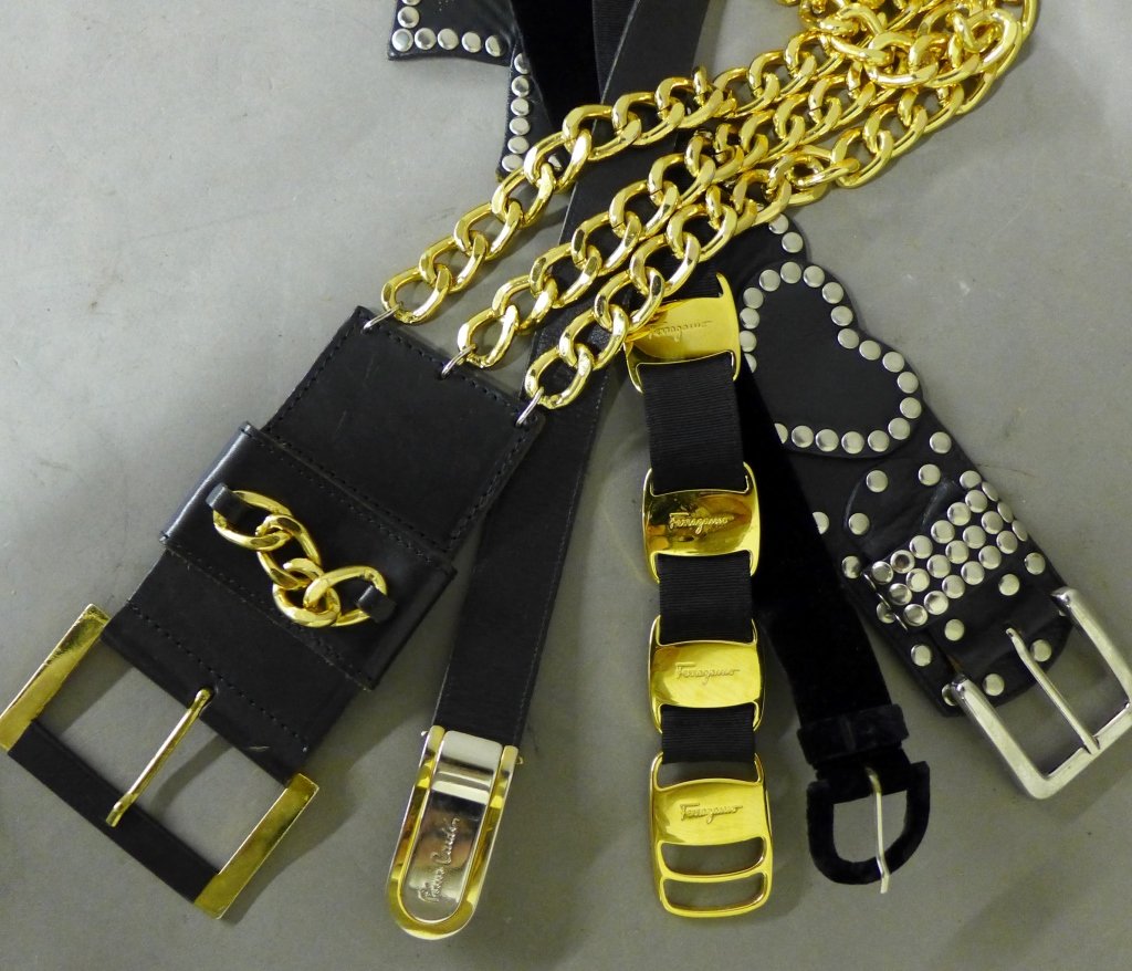 Women's Designer Waist Belts: Collection of 5 black belts for women. Assortment includes: -Bonwit Teller designer ladies black leather and gilt chain adjustable belt. Maker's mark on inside of belt. Total length: 35 3/4" -Black le