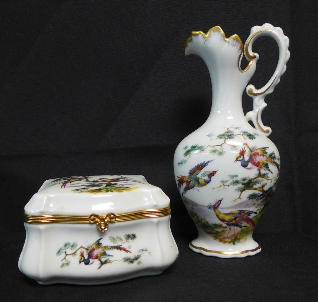 Limoges Trinket Box and Ewer: Beautiful vanity set with phoenix design. Pitcher has painted gilt accents and hinged box has gilt metal hardware. Maker's marks on the bottom of both. Height of ewer: 7" & Box Width: 4 1/2"(Phoenix T