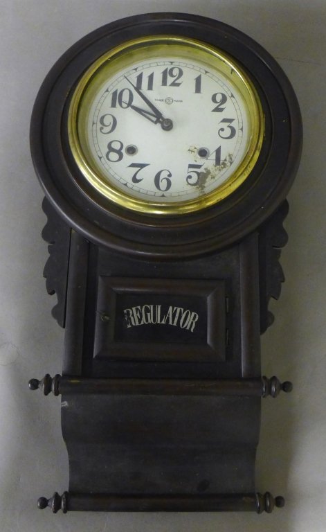 Antique Regulator Wall Clock: Nice Trademark Regulator wall clock in wood case. With pendulum. Some wear and imperfections. Height: 22 1/2", Width: 12" (time, decorative accessory, vintage, antique, collectible)STERLING ASSOCIATES