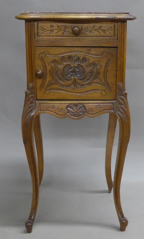 Antique Marble Top Nightstand: French Rococo style nightstand with cabriole legs and fine hand-carved detail. Top Drawer and cabinet door below. Door opens to reveal white marble interior (missing left side marble). Height: 33 3/4"