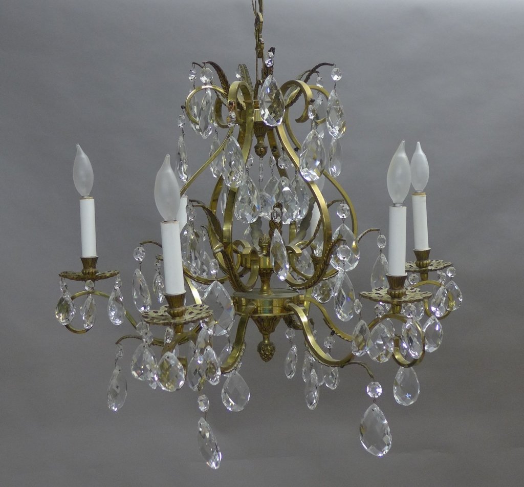 Vintage Brass and Crystal Chandelier: 6 light brass and crystal chandelier. Scrolling and sculpted foliage elements on finials and arms. Includes canopy. Height (without chain): 23", Width: 26" (lighting, electrical, dining room, traditio
