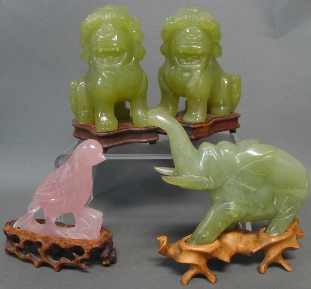 Carved Natural Stone Animal Sculptures: Vintage figurines include: jade elephant, 2 jadeite foo dogs/ lions and a rose quartz bird. All on carved wood bases. Some chipping. Old repair to bird. Total height of foo lion: 4 3/4", Width: 2 1/2"