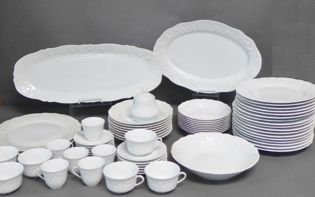Porcelaine Philippe Deshoulieres Limoges: Large collection of Limoges white fine china dinnerware. Fruit and foliage motif around outer edge. Maker's mark on bottom. Assortment includes: -long fish platter. Length: 22" -Oval serving tray. Len