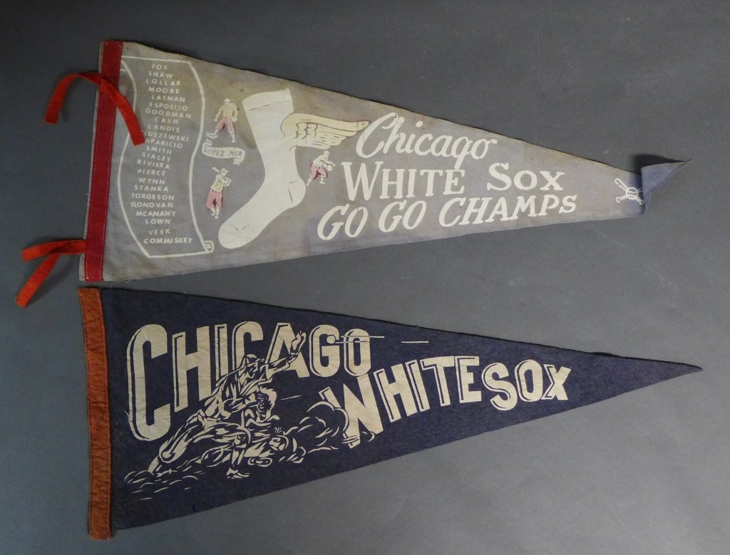 Vintage Chicago White Sox Pennant Flags: Two vintage felt flags. 1959 Chicago White Sox roster Pennant and rare flag with player action scene over lettering. Some fading, imperfections and noticeable wear. Height of larger flag: 11", Length: