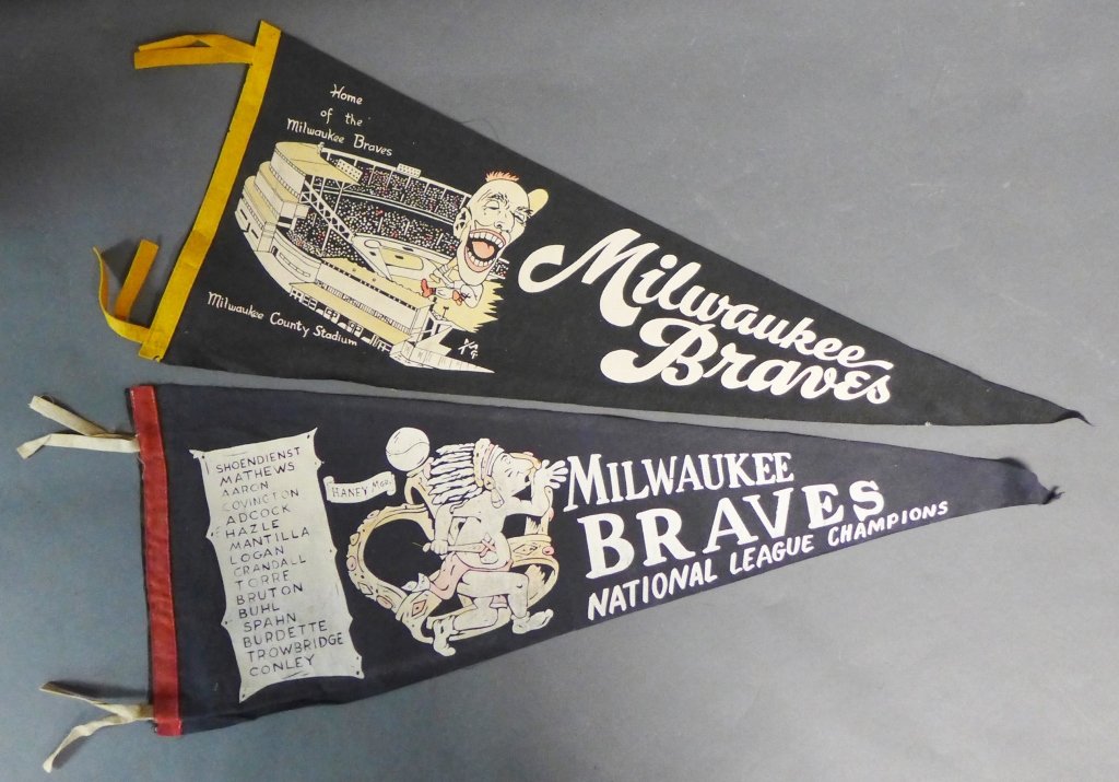 Milwaukee Braves Pennant Flags: Two felt pennant flags. Vintage 1950's Milwaukee Braves Pennant featuring a screaming Indian with a baseball bat beside Milwaukee County Stadium. Milwaukee Braves National league champions felt pennan