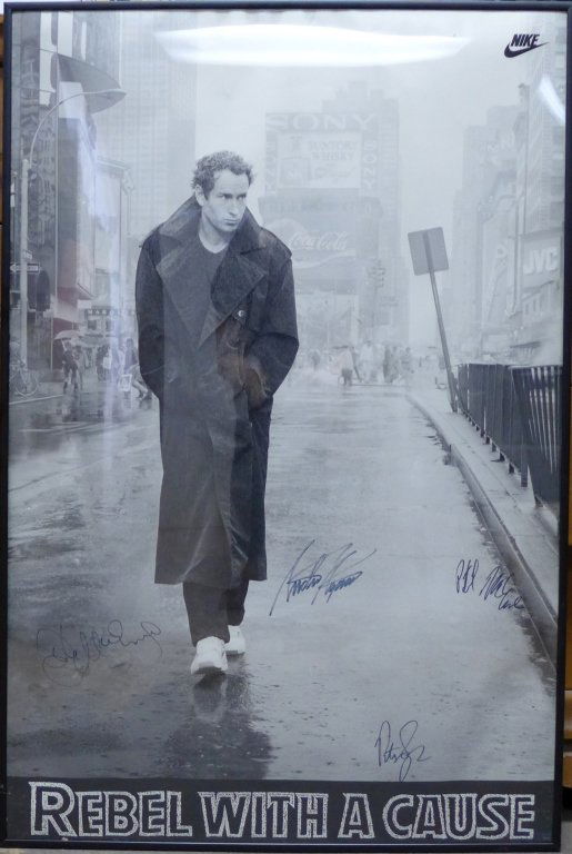 Rebel With a Cause Nike Tennis Autograph Poster: Vintage John McEnroe "Rebel With A Cause" Poster. This poster is an homage to James Dean, with tennis' consummate rebel, John McEnroe, strolling through Times Square in a trench coat wearing his Nike
