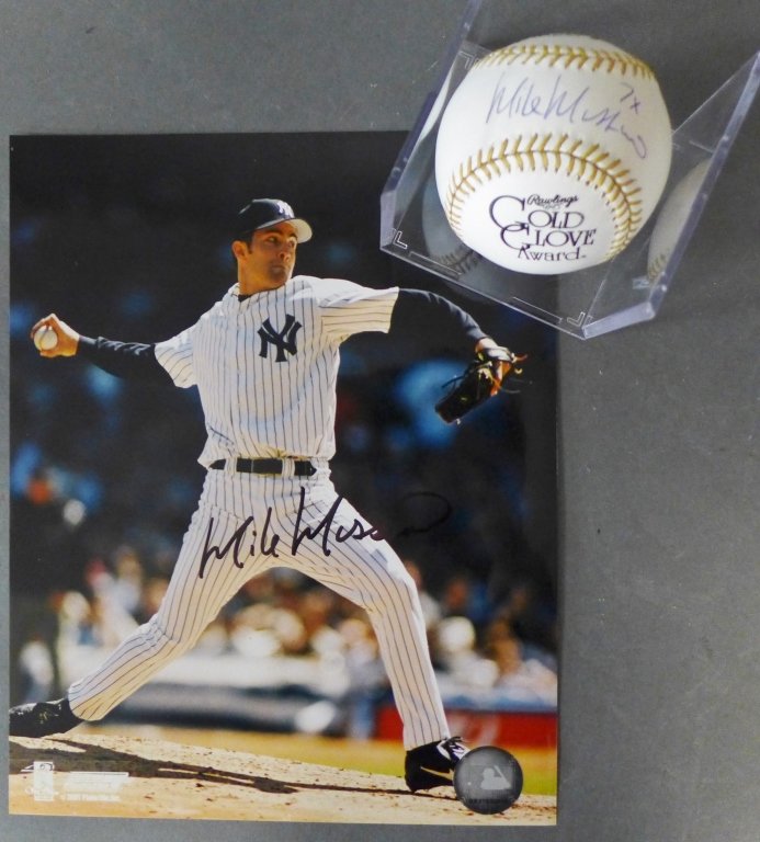 Mike Mussina Autographed Photo & MLB Ball: Mike Mussina Autographed Photo & Baseball. Signed MLB Baseball w/ "7x Gold Glove" inscription. JSA Sticker # D98488. Also includes autographed photo. No Paper COAs. (MLB, baseball, collectible, Major 