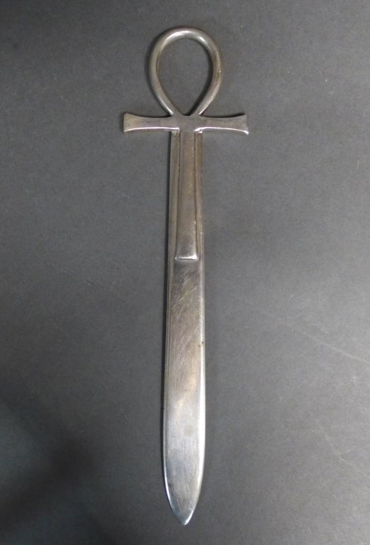 Sterling Silver Vintage Ankh Letter Opener: Unique Egyptian Revival design. Hallmarks stamped on lower portion of cross. Length: 7 3/4" Some signs of age, wear, nicks, and scratches. Approximate total weight: 71 grams(paper knife, decorative ac