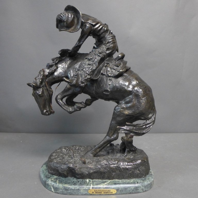 20th C Bronze cast after Frederic Remington: "Rattlesnake" Contemporary patinated bronze after Frederic Remington on green marble base. Signature on base reads: copyright Frederic Remington. Plaque on oval marble base reads: RATTLESNAKE by Frede