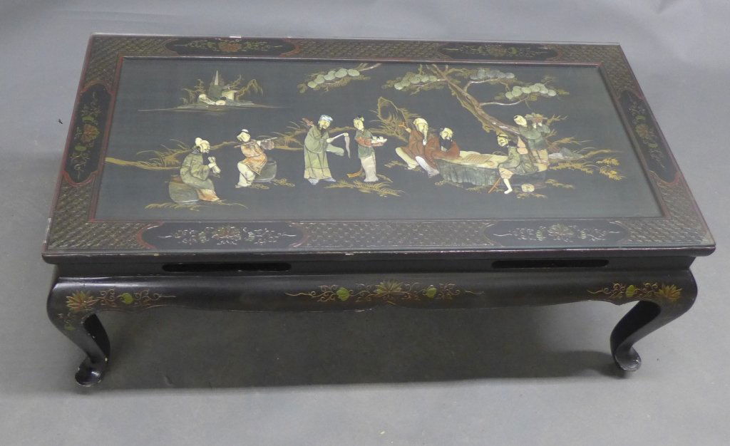 Chinoiserie Lacquer & Mother of Pearl Inlay Table: Beautiful coffee table with glass top and hand painted and inlay decorations. Carved wood table with pierced accents on apron and dragon legs. Some slight wear and imperfections. Height: 15 1/2", Widt