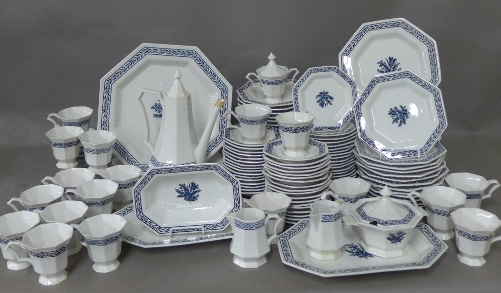 Independence Ironstone Dinnerware for 14 Plus: Blue and white octagonal dinnerware with blue flower in the center with blue border. Collection includes: -2 large trays. Noticeable chip on edge of one. Width: 14" -2 oval serving trays. Width: 13" -