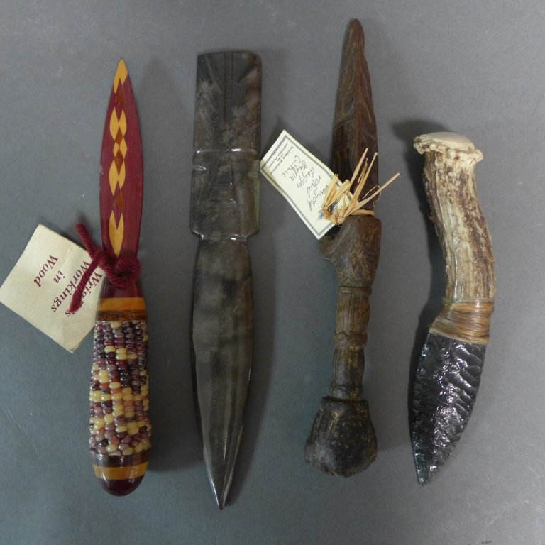 Four Daggers and Letter Openers: Collection comprising of: an inlaid wood letter opener with corn handle, a carved wood dagger from the Sherpa culture, horn handled example, and a carved hardstone example. Lengths vary: 6 1/2"- 8 3/4