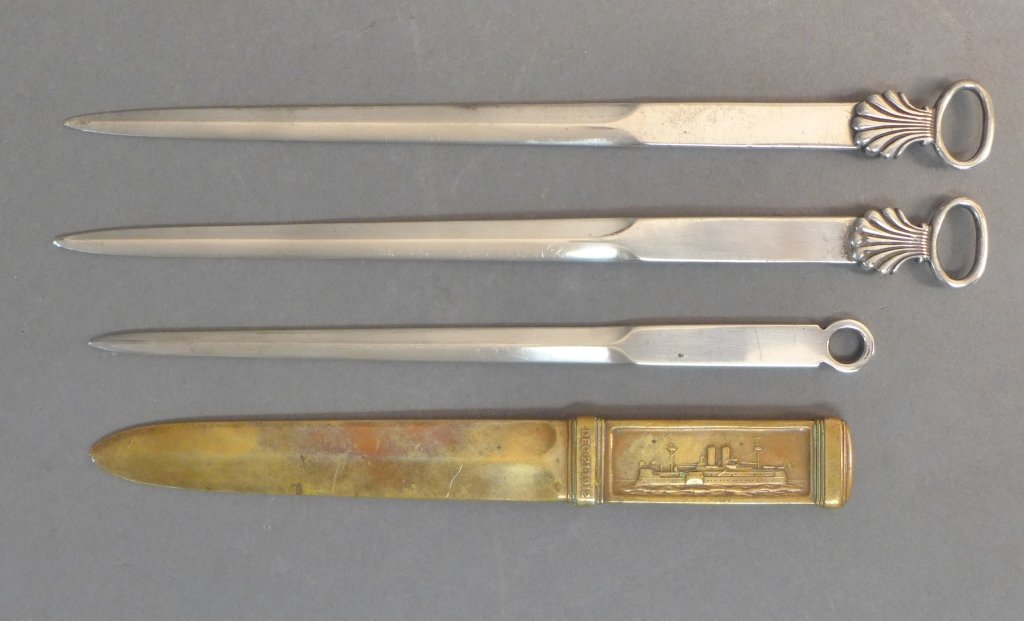Collection of Tiffany & Co. Letter Openers: Assortment includes: -2 Tiffany & Co. Sterling silver sword shaped letter openers with a shell and oval. 1953 Queen Elizabeth II Coronation. Side is stamped: Tiffany & Co. Makers Sterling. Length: 9 1