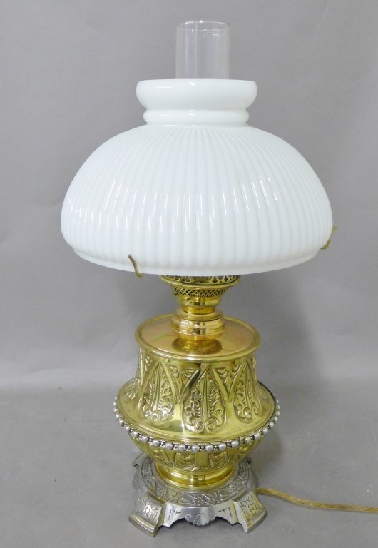 Cast-Brass Fluid Lamp: Beautiful silver and gold tone table lamp. With white milk glass shade, stamped Bradley and Son underside. Electrified and fitted as a lamp, some minor wear. 20th Century. Height up to socket: 11 1/2"
