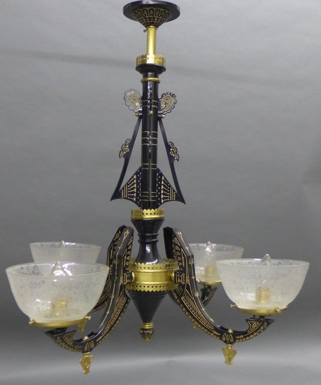 Egyptian Revival Chandelier: Egyptian Revival style black and gold tone metal 4 arm chandelier with etched glass shades. Some chips to the bottom of the glass shades. Height: 31", Width: 30" (lighting, electric, interior design, 