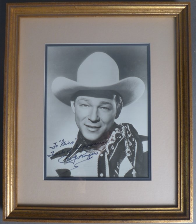 Roy Rogers Autographed Photo: Black and white photograph of Roy Rogers. Signed and inscribed bottom left. Roy Rogers (born Leonard Franklin Slye; 1911 – 1998) was an American singer and cowboy actor who was one of the most popul