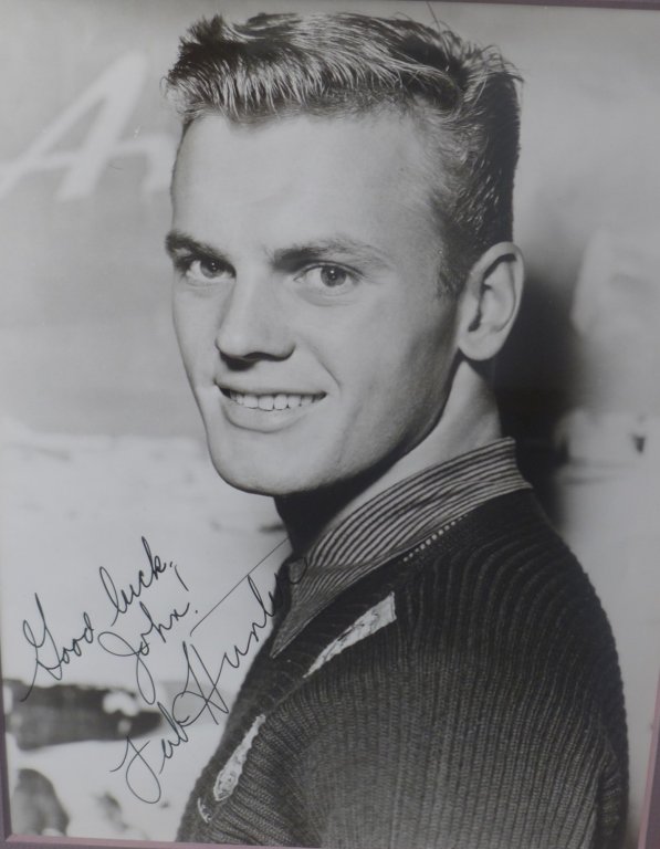 Tab Hunter Autographed Photo: Black and white photograph of Tab Hunter. Inscribed (Good Luck John!) and signed. Framed & matted. No COA. Height: 16"; Width: 14". Image Size Height: 9"; Width: 7". Tab Hunter (born Arthur Andrew Kel