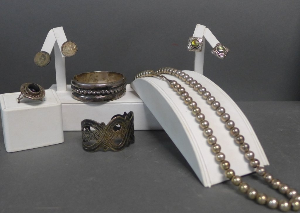 Sterling Silver Jewelry Collection: Grouping includes:-Sterling silver hinged bracelet cuff. Marked: 925 Mexico.-sterling silver and abalone shell earrings. Posts are bent and do not include earring backs.-Sterling silver and onyx ring.