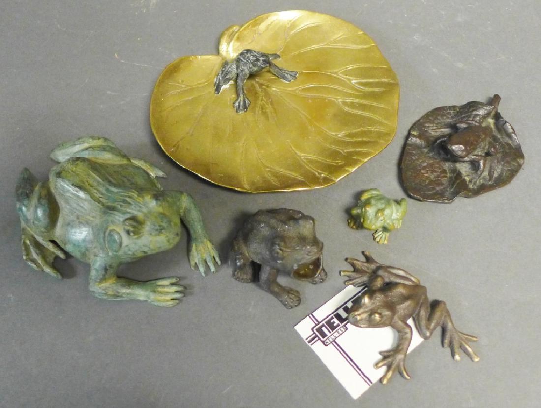 Patinated Bronze Frog Figurines: Six bronze and brass frog sculptures. Includes: -Patinated frog sitting on a bronze lily pad dish. Unsigned. Width: 7 1/2" -Patinated bronze frog on leaf. Unsigned. Width: 4 3/4" -Nelles cast bronze f