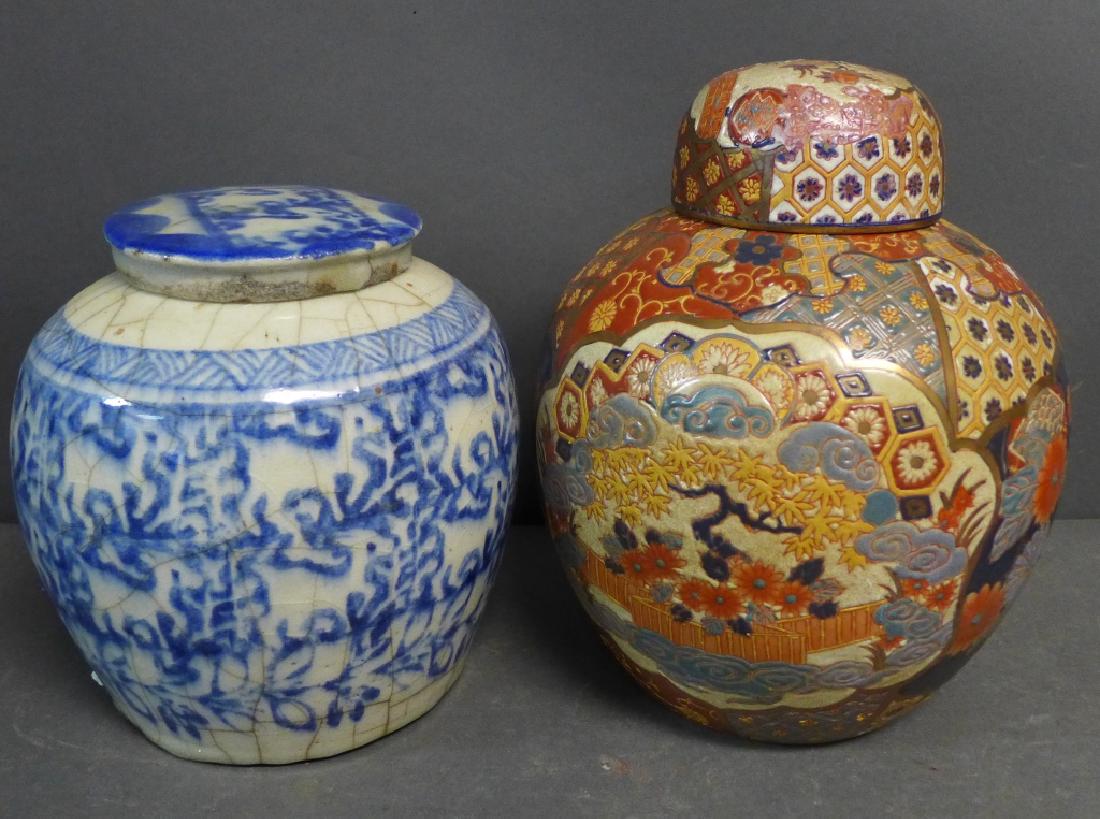 Pair of Asian Covered Jars: Satsuma rose jar has maker's mark on bottom. Blue and white glazed jar and lid has crackle finish. Some residue and slight chipping. Heights: 8" & 10" (Japanese, Chinese, Oriental, Asian, pottery, cer