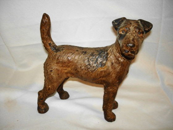 Antique Iron doorstop Brown Terrier: Antique iron doorstop , Brown Terrier. Original finish. 8 1/2 (H) x 8" (L)