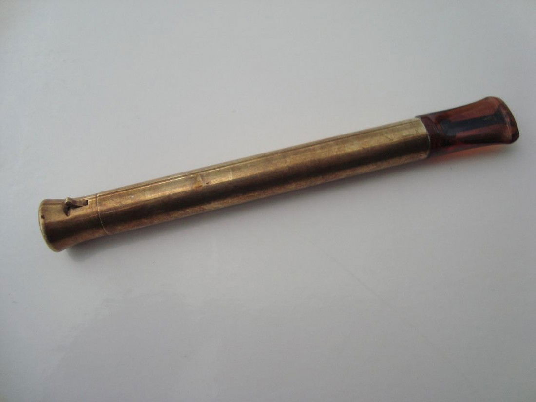 Cartier "Zeus" 14k gold cigarette holder: Vintage 14k gold cigarette holder.Marked Cartier ,"Zeus", 14kDimensions: 4 5/8" x 3/8".Condition: Excellent vintage condition. Mouthpiece shows evidence of use, appropriate for age.