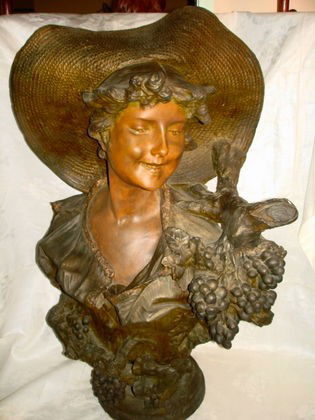 Terra Cotta Bust, after Louis Carpeaux: Terra Cotta Bust after Louis Carpeaux, bronze painted finish.Dimensions: 30"h x 20"w.Condition: Professional repair to branch noted. Minor chip (repaired roughly) at end of branch. Minor paint loss no