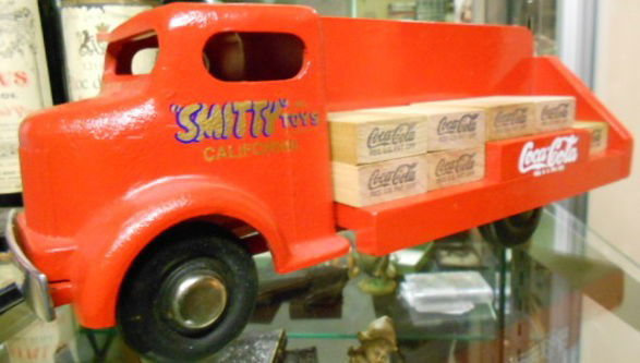Smith & Miller Coca Cola truck, restored: Vintage Smith & Miller Coca Cola truck. Cab is pressed steel, body is constructed out of wood, new paint all around. Load blocks are repro.Dimensions: 13 3/4" (L) x 5 1/2" (H)